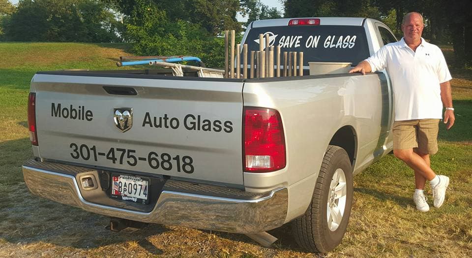 photo of business owner in front of his truck